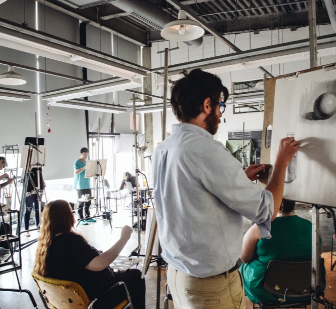 Students drawing on artboards