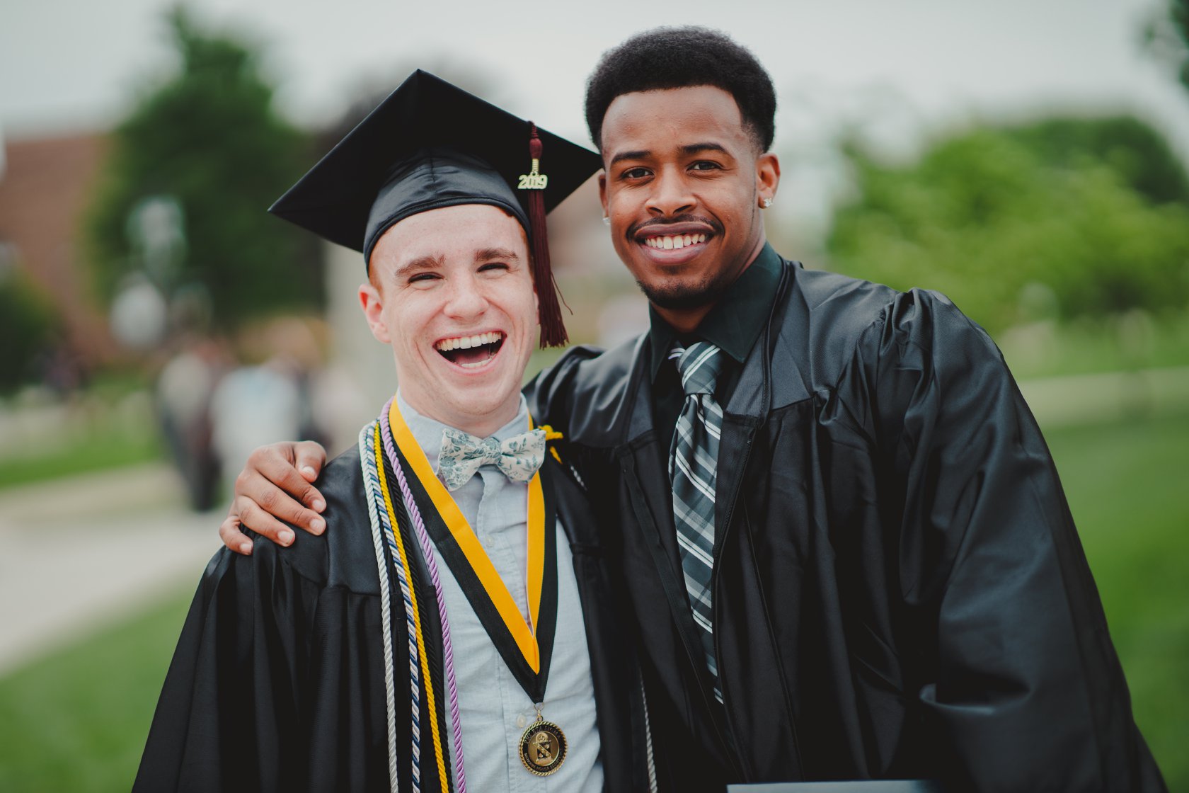 Two male students at graduation