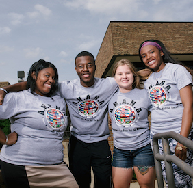 Diverse group of students wearing AHANA t-shirts