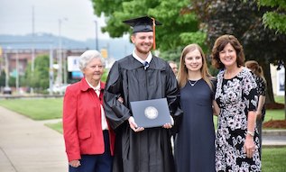 family with male graduate at Commencement