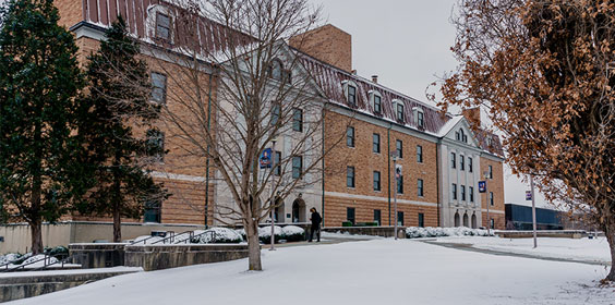 picture of Massie Hall blanketed with snow
