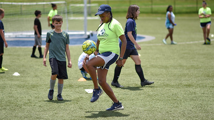 photo of woman demonstrating soccer skills