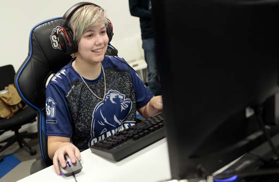 photo of girl playing game on a pc