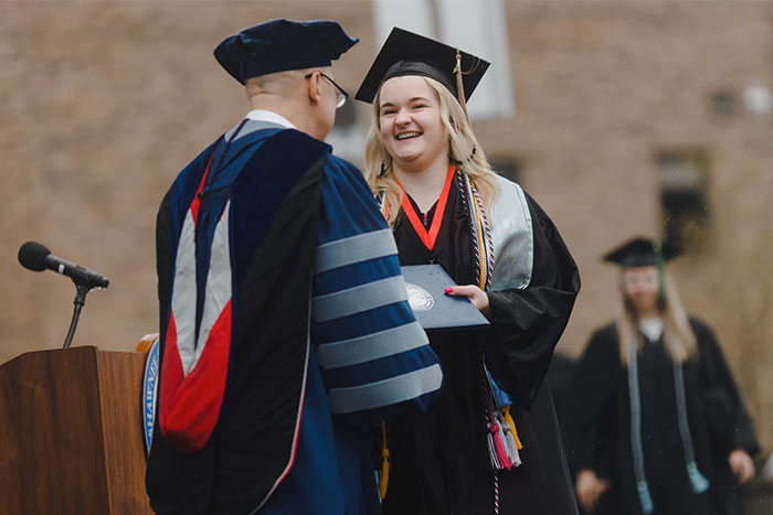 Taylor Jo Young receiving her diploma