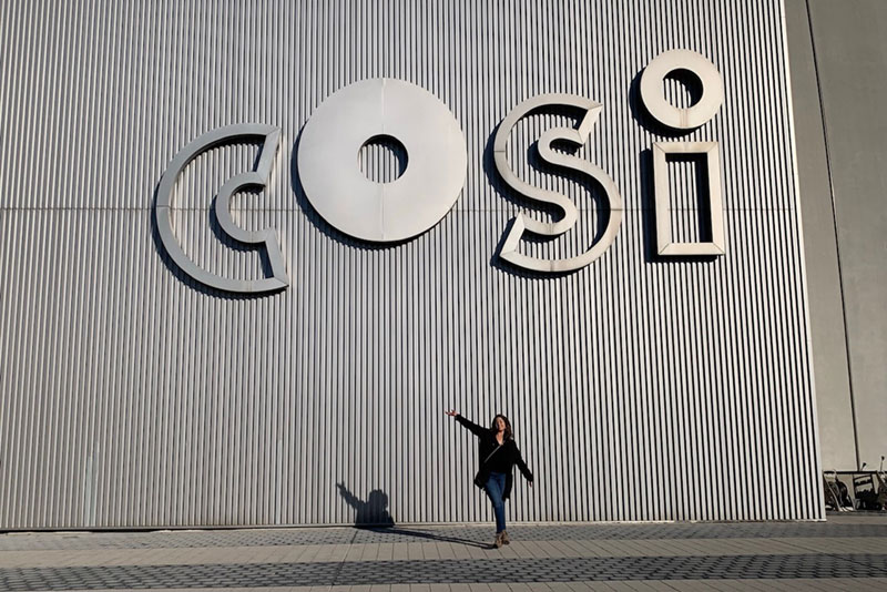 Anna Trankina in front of COSI sign
