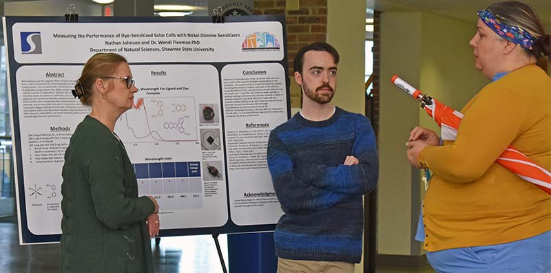 Nathan Johnson with poster