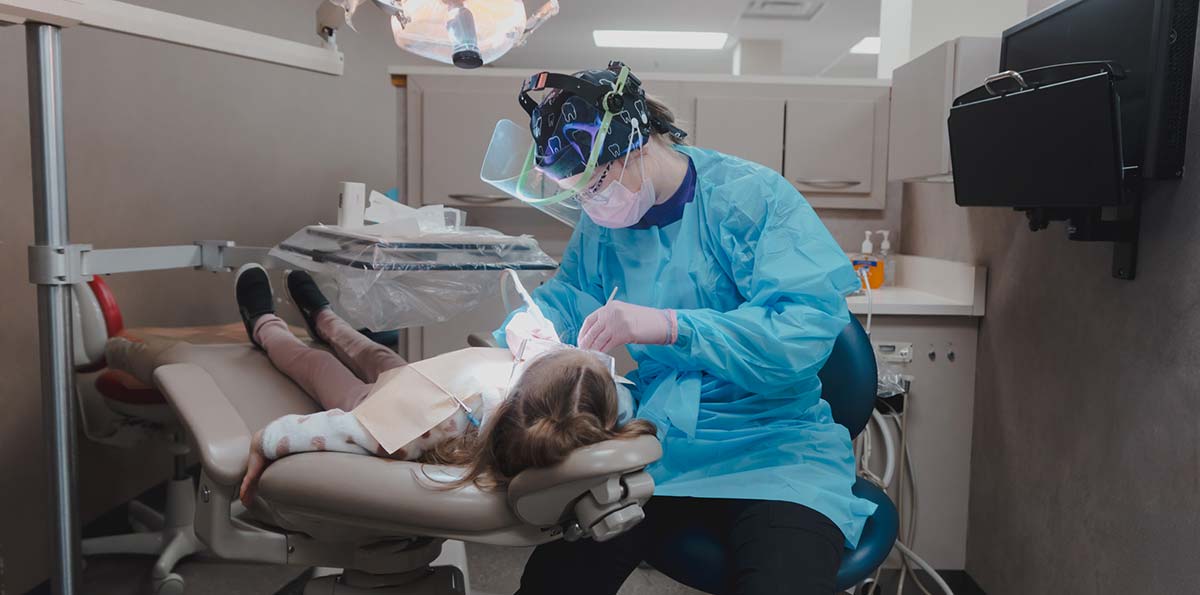 student interacting with patient at Dental Hygiene Clinic