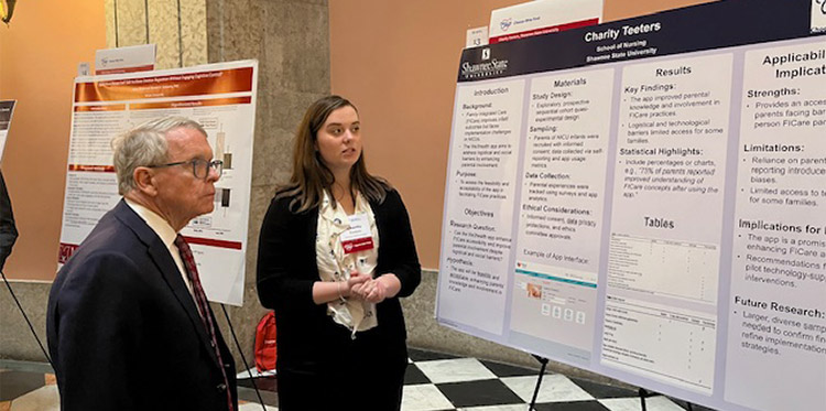 Charity Teeters showcasing her presentation