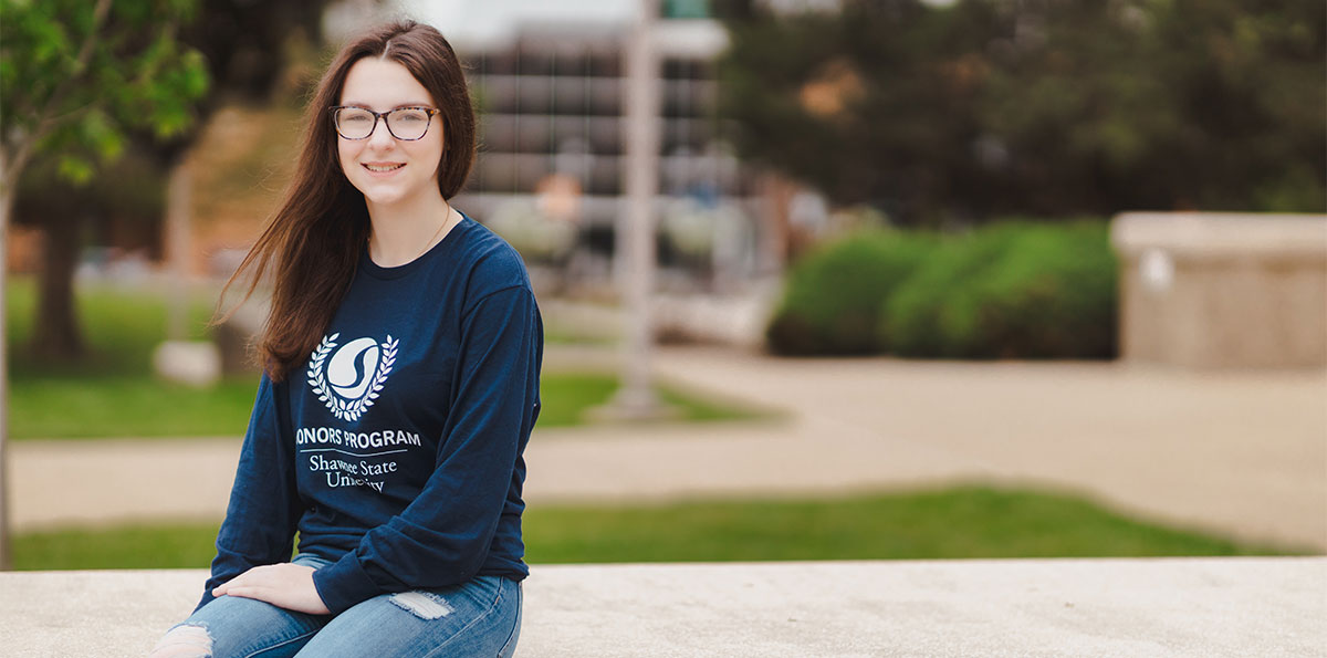 Audra Smith sitting outside on SSU campus