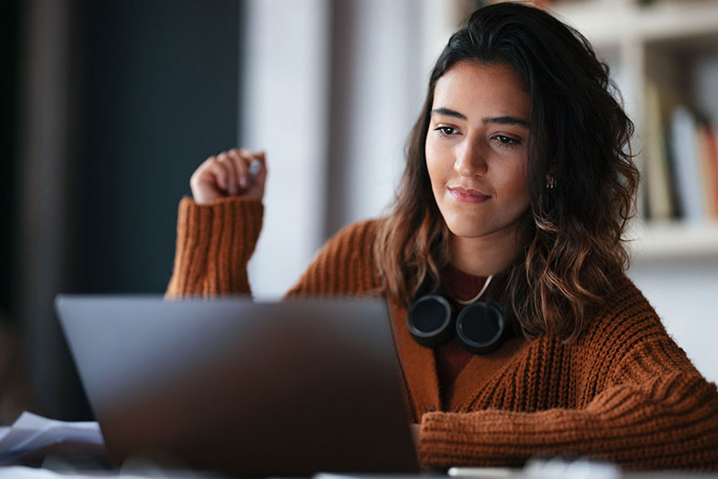 woman studying on laptop computer