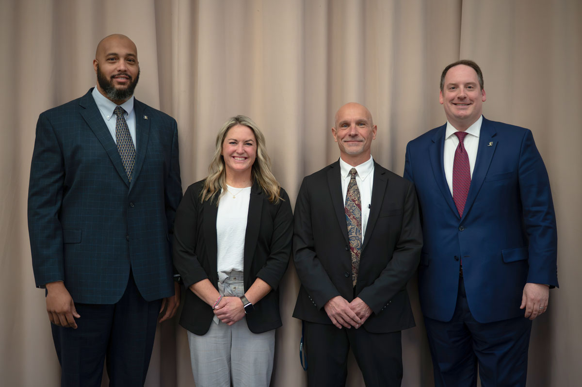 From left: Shawnee State University Athletic Director Gerald Cadogan; Head Softball Coach Kristen Bradshaw; Director of Planning, Construction and Facilities John Temponeras; and President Eric Andrew Braun gather to celebrate the launch of new softball facilities on campus.