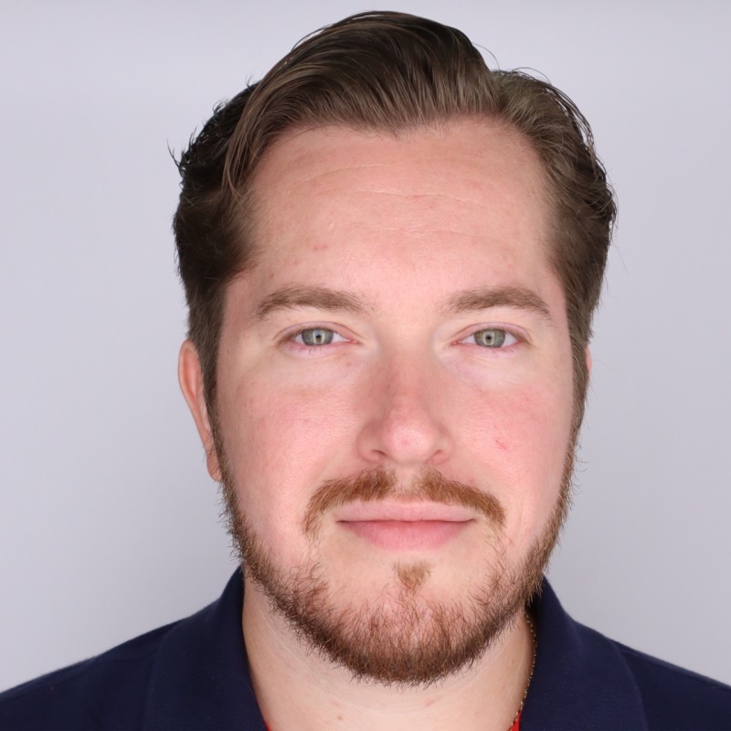 Jordan Murrey headshot male in blue shirt