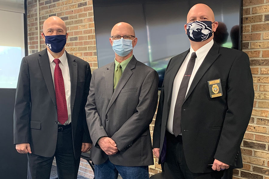 Charles Hosey posing for photo with Jeff Bauer and Jon Peters