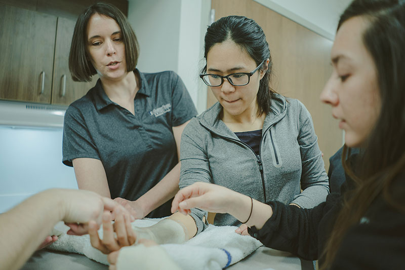 Students in lab setting receiving instruction