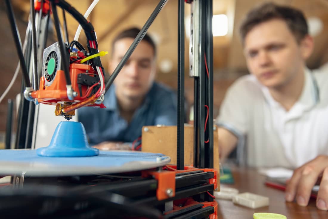 Students using new generation of 3D printing machine for plastic.