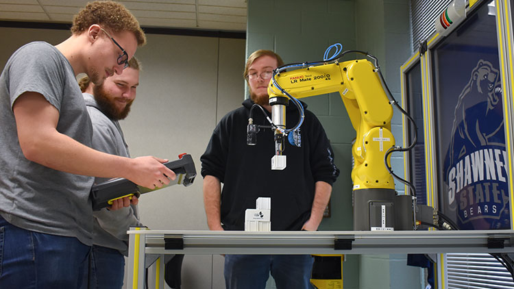 picture of students working in SSU robotics lab