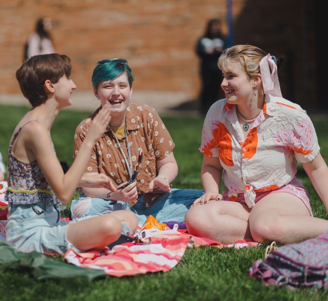 students sitting together on campus