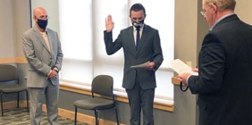 Eli Cole being sworn in as a Student Trustee