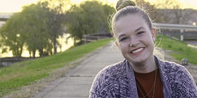 Grace Eberhard sitting on the floodwall