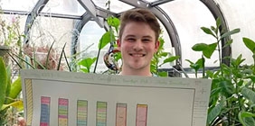 Jacob Smathers holds his garden plot design