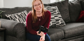 portrait of Brianna Buchholz holding camera