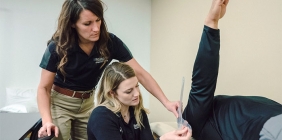 student and instructor in lab