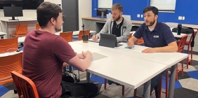 picture of students talking at table