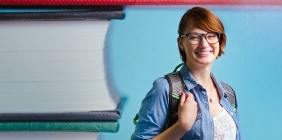 photo of woman with backpack on campus