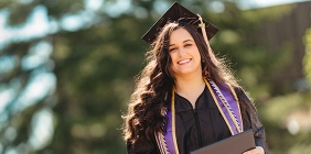 woman walking with diploma