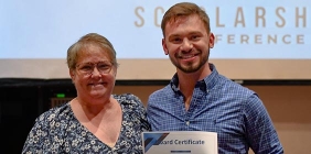 photo of Tanner Shepherd receiving award