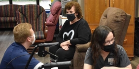 picture of student assisting others in senior center