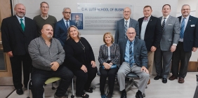 group photo in front of sign