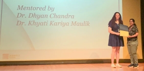 Hannah Tackett receiving an award on stage