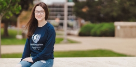 Audra Smith sitting outside on SSU campus