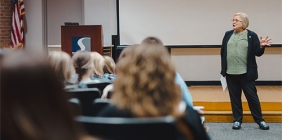 Dr. Christine Raber addresses students