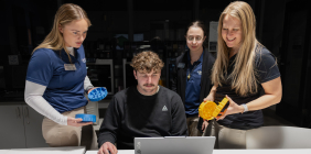 SSU students collaborating on a 3D-printed assistive device.