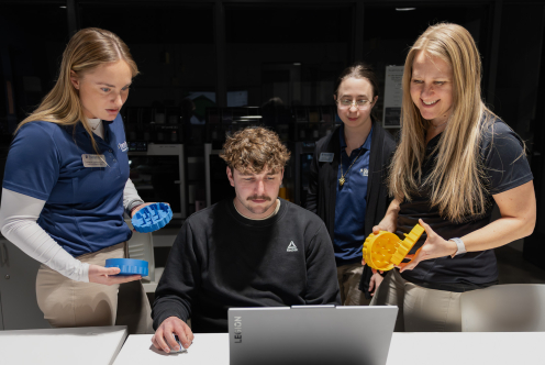 SSU students collaborating on a 3D-printed assistive device.